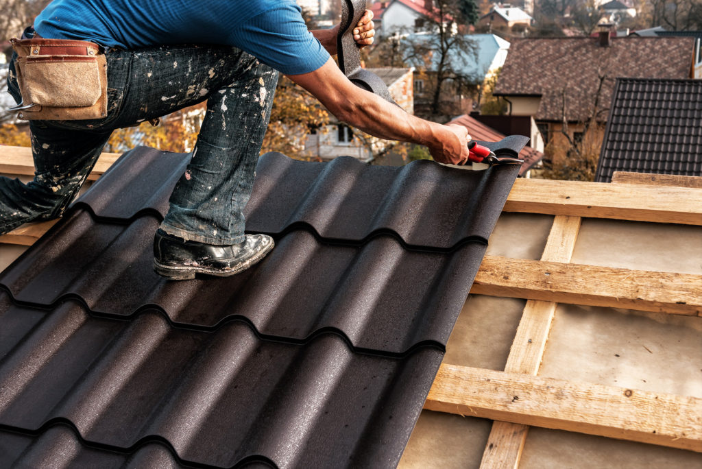 professional roofing contractor repairing a roof
